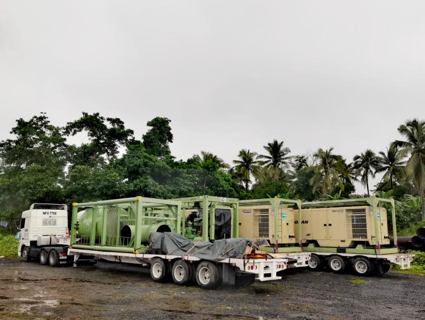 A truck with trailers containing ADA machinery